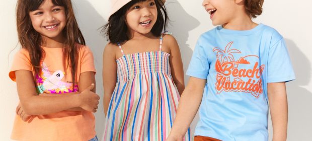 three kids wearing a modern dresses and talking each other