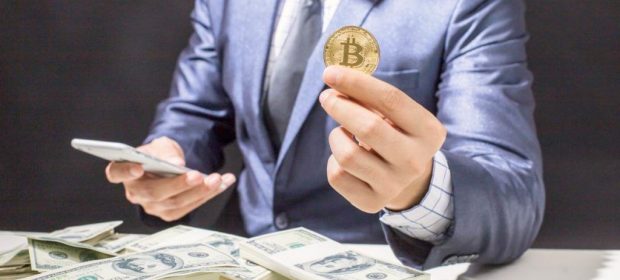 A man holding a coin